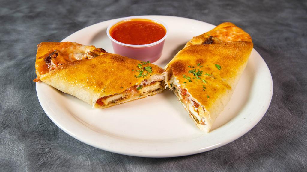 Chicken Roll · Chicken parmigiana, wrapped in dough and baked to perfection