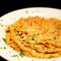 Penne Alla Vodka · Penne pasta tossed in a pink vodka cream sauce with ground beef
