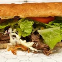 Steak & Cheese · Steak and cheese is served with green peppers, lettuce, mozzarella, mushrooms, onions, steak...