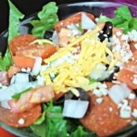 Chef Salad · Chef salad is served with cheddar cheese, croutons, green peppers, ham, lettuce, onions, tom...
