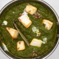 Saag Paneer · Fresh cheese cooked in fresh spinach gravy.