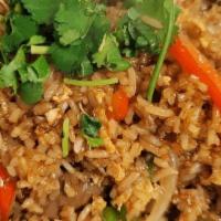 Spicy Basil Fried Rice · Stir-fried choice of meat with jasmine rice, eggs, white onion, basil, bell peppers, green o...