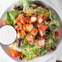 Sticky Finger Salad · Chopped sticky fingers, lettuce, shredded cheddar jack cheese tomatoes, and craisins, with h...