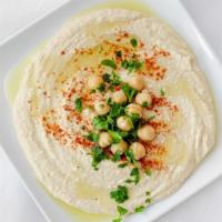 Hummus · A smooth mixture of garbanzo beans, tahini, garlic, oil, and lemon that pairs perfectly with...