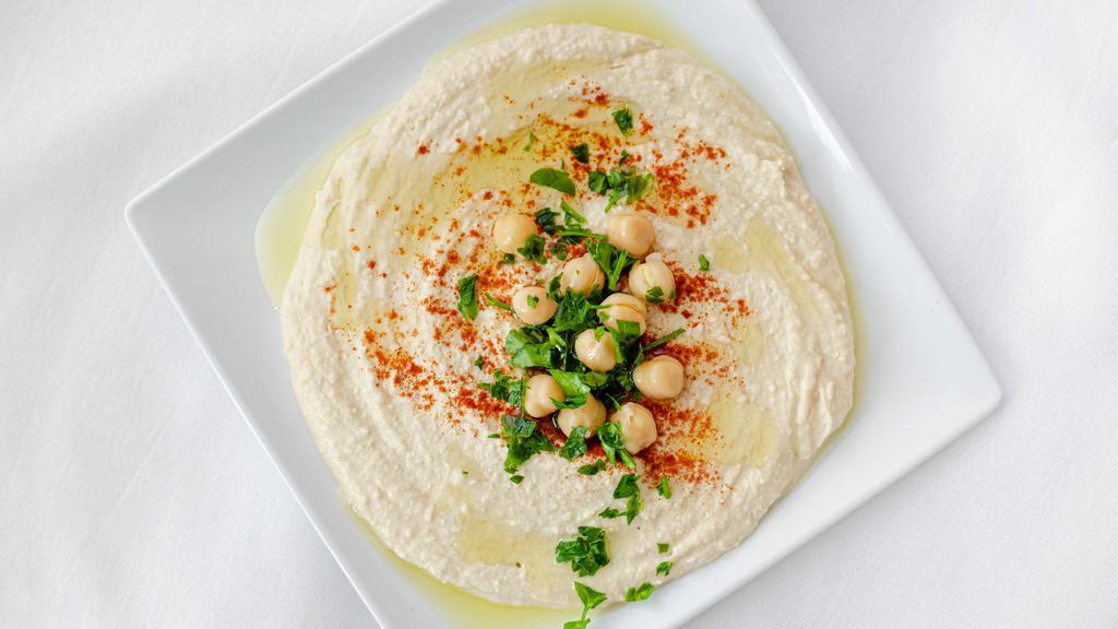 Hummus · A smooth mixture of garbanzo beans, tahini, garlic, oil, and lemon that pairs perfectly with pita bread. VGN GF