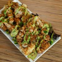 Arnabeet · Lebanese style fried cauliflower tossed in our salt and pepper mix and topped with tahini. V...