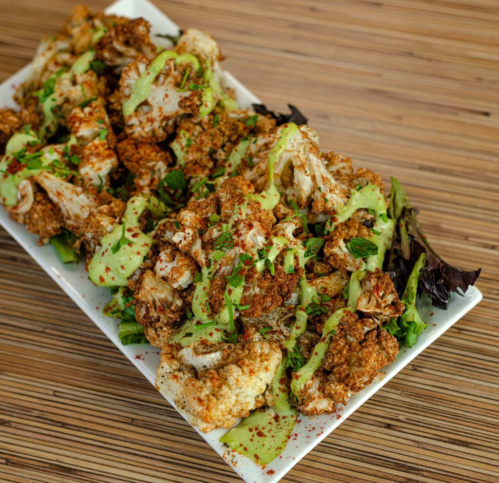 Arnabeet · Lebanese style fried cauliflower tossed in our salt and pepper mix and topped with tahini. VGN GF