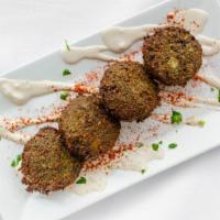 Falafel Balls · Garbanzo beans, parsley, onion, and spices formed into balls and fried. Served with tahini. ...