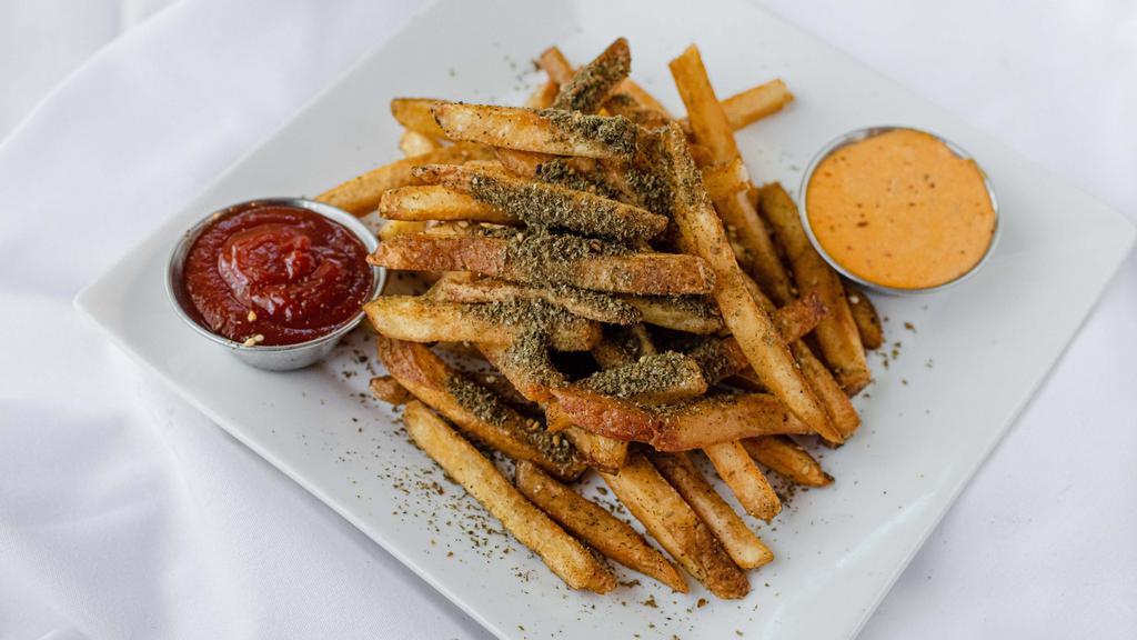 Zaatar Fries · House cut fries tossed in zaatar and served with harissa sauce. VGN GF