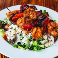 Chicken Breast Kabob Salad · Chicken breast marinated in olive oil, garlic, yogurt, paprika, and lemon. Served with two s...