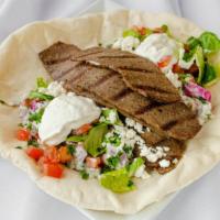 Lamb Gyro Wrap · Classic Greek style lamb gyro. Made with feta cheese and tzatziki. Each wrap is loaded with ...
