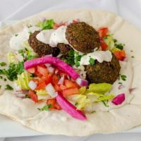 Falafel Wrap · Garbanzo beans, parsley, onion, and spices formed into balls and fried. Made with tahini. Ea...