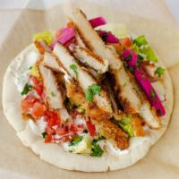 Nicholas'S Chicken Wrap · Sliced breaded chicken breast. Made with tzatziki. Each wrap is loaded with lettuce, onions,...