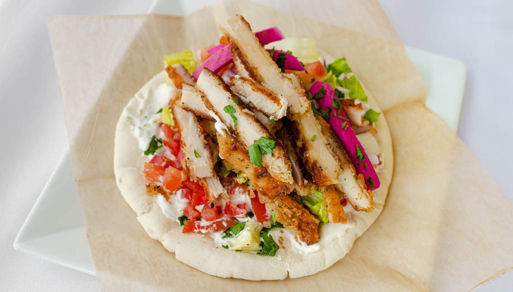 Nicholas'S Chicken Wrap · Sliced breaded chicken breast. Made with tzatziki. Each wrap is loaded with lettuce, onions, tomatoes, pickled turnips, and parsley.