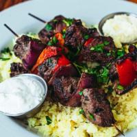 Lamb Kabob Plate · Lamb marinated in olive oil, garlic, mint, and lemon. Kabob plates are served with two skewe...