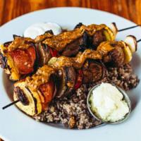 Veggie Kabab Plate · Tomato, potato, eggplant, mushroom, zucchini, and garlic topped with our sweet pesto herb dr...