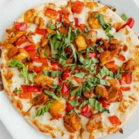 Chicken Kabab Pizza · Mozzarella cheese, chicken, toum, red pepper, shredded basil, and parsley.