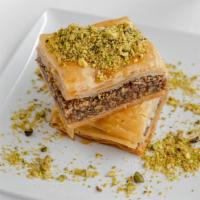 Baklava · Crispy phyllo dough layered with walnuts and simple syrup. (Vegan)