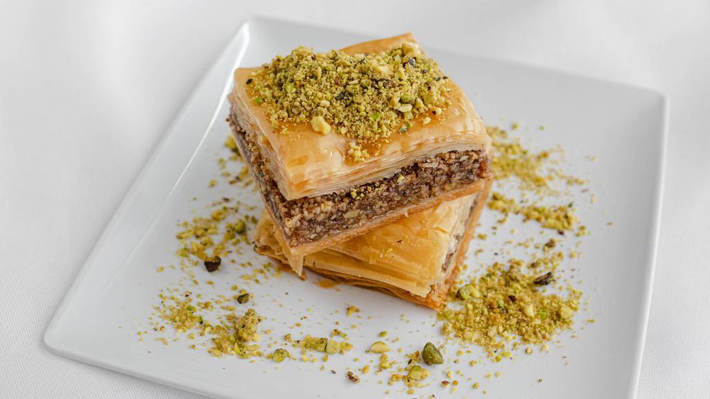 Baklava · Crispy phyllo dough layered with walnuts and simple syrup. VGN