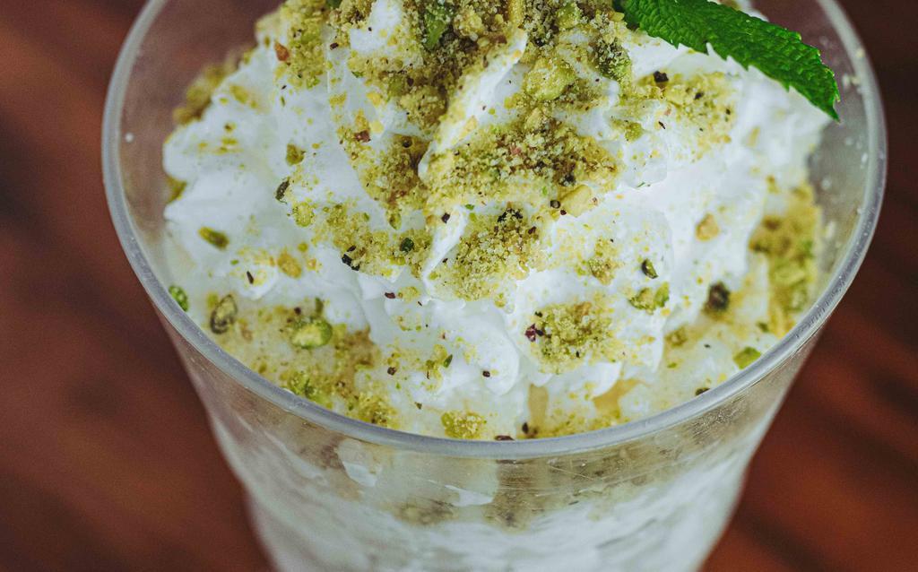 Lebanese Pistachio Rice Pudding · Lebanese style rice pudding topped with pistachios and cinnamon. (Gluten Free)