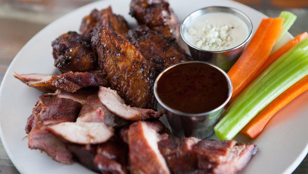 Combo Plate · Gluten-free. A half order of wings and a half order of tangos served with your choice of house-made ranch or blue cheese, our honey citrus dipping sauce plus carrot & celery sticks.