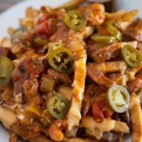 Loaded Fries · Gluten-free. Fresh French fries topped with BBQ beans, cheese sauce, and jalapeños. Add baco...