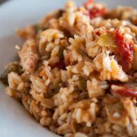 Bourbon St. Jambalaya · Smoked chicken, spicy Cajun sausage, shrimp, and rice in a lightly spicy tomato base. Served...