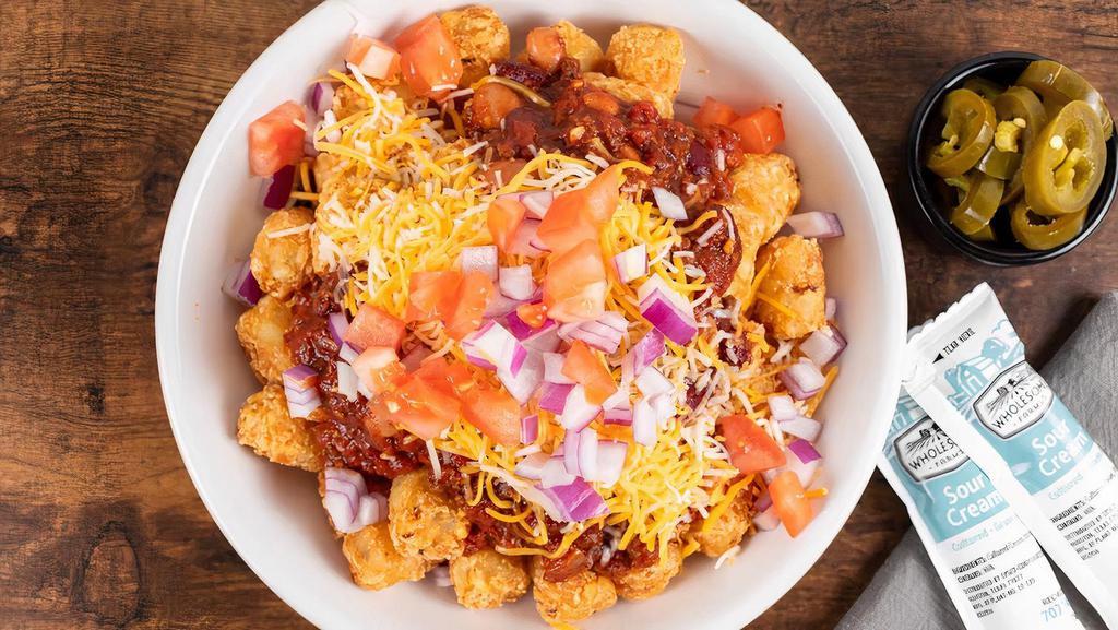 New!: Chili Totchos · Large portion of crispy tater tots, our award winning beef and bean chili, shredded cheddar jack cheese, diced tomato, and diced onions.  Served with sour cream on the side.