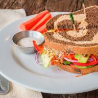 Vegetable Sandwich · Vegan. Avocado sprouts, tomatoes, cucumbers, red onions, red peppers, carrots and sunflower ...