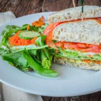 Flt Sandwich · Vegan. Fresh tomatoes, crisp lettuce, avocado and our house made sun dried tomato facon on y...