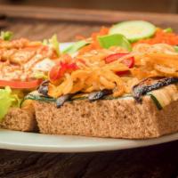 Grilled Veggie Sandwich · Vegan. Mushrooms, zucchini, sautéed onions and peppers with lettuce, tomato, mustard, vegeni...