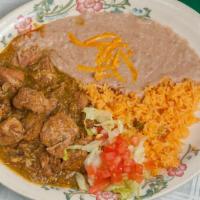 Chile Verde · Spicy. Pork loin braised in a green “tomatillo” sauce, green peppers, onions and spices, ser...