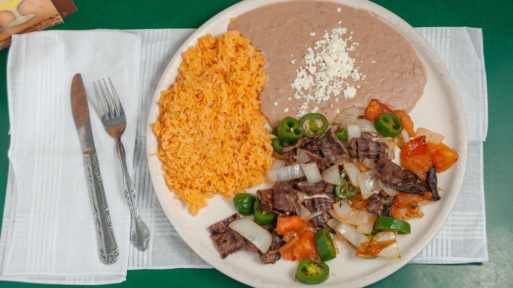 Pancho Villa” Plate · Skirt steak, slices of fresh jalapeño peppers, garlic, onions, tomato and spices served with rice and beans.