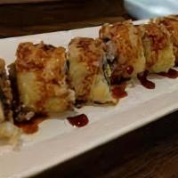 Las Vegas Roll · Salmon, crab and cream cheese lightly
tempura battered and topped eel sauce.