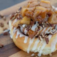 Apple Pecan Roll · Topped with toasted pecans and spiced apples.