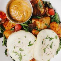 Two Fried Eggs Bowl · two pasture-raised fried eggs*, applewood bacon, harissa home fries, caramelized onions, roa...
