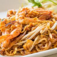 Pad Thai Noodles · Springy, thin rice noodles stir fried with a sweet and savory tamarind sauce, egg, garlic, t...