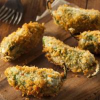 Jalapeño Poppers (4 Pcs) · Spicy jalapeños stuffed with cheese, lightly breaded and fried until crisp and golden on the...
