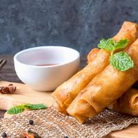 Fried Spring Rolls · Crispy fried veggie spring rolls served with your choice of sauce.