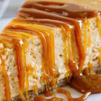 Dulce De Leche Cheesecake · Smooth, creamy perfection on a sinful graham cracker crust and topped with a luscious dulce ...