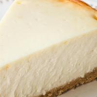 New York Style Cheesecake · Smooth, creamy perfection on a sinful graham cracker crust.