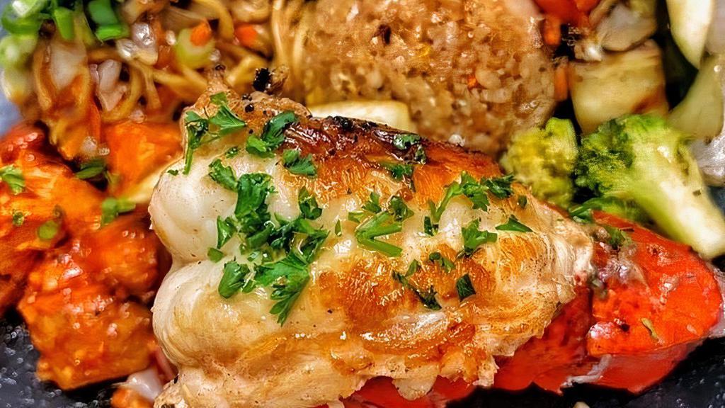 Lobster Plate · Our famous WHOLE LOBSTER TAIL Plate with 2 additional proteins, 2 sides, rice or noodles, and a salad.
