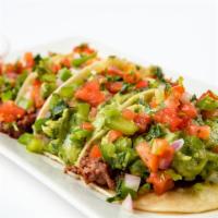 2 Bite Tacos · 4 grilled 2 bite corn tortillas filled with steak or chicken, fresh pico & served with a lim...