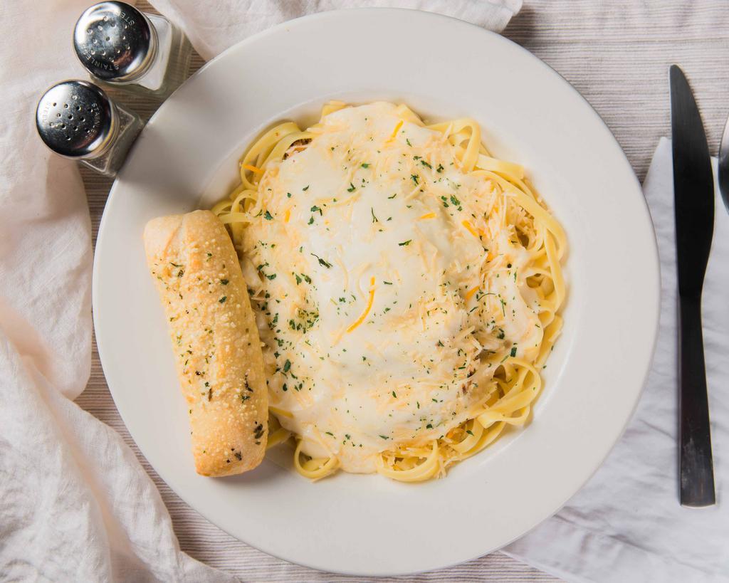 Chicken Alfredo · Grilled chicken on a bed of fettuccine in a creamy alfredo or pesto basil sauce & served with a garlic butter dinner roll.