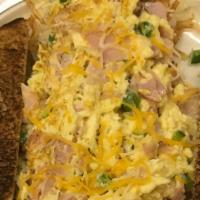 Denver Scramble · Hash browns topped with eggs, ham or sausage. onions, bell peppers, Colby Jack cheese and a ...