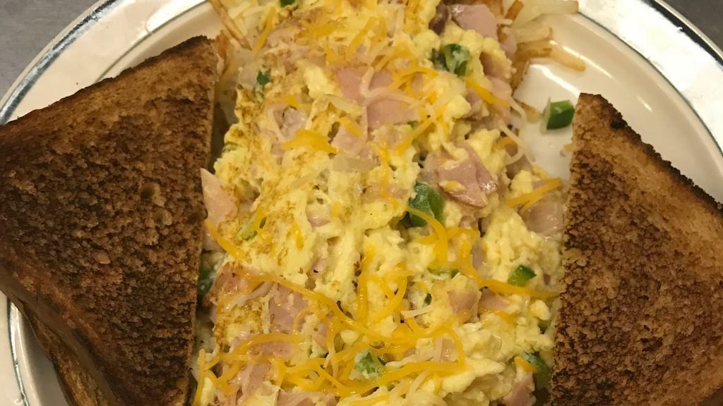 Denver Scramble · Hash browns topped with eggs, ham or sausage. onions, bell peppers, Colby Jack cheese and a side toast.