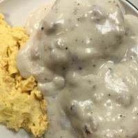 Biscuits & Sausage Gravy · Two homemade biscuits smothered with Home gravy and topped with two eggs