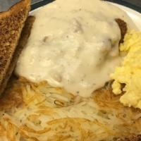 Chicken Fried Chicken · Breaded Chicken Breast served with 2 eggs hash browns smothered with country gravy and toast