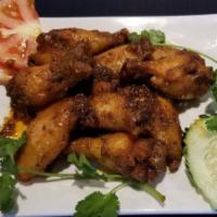 Jumbo Chicken  Wings (8 Pcs) · Garlic and Butter, Buffalo hot  sauce, Thai Sweet Chili or Mango Habanero.