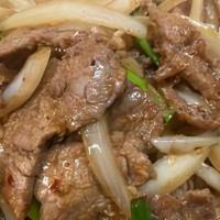 Mongolian Beef · Beef stir-fried with yellow onions and scallions in a spicy sauce.